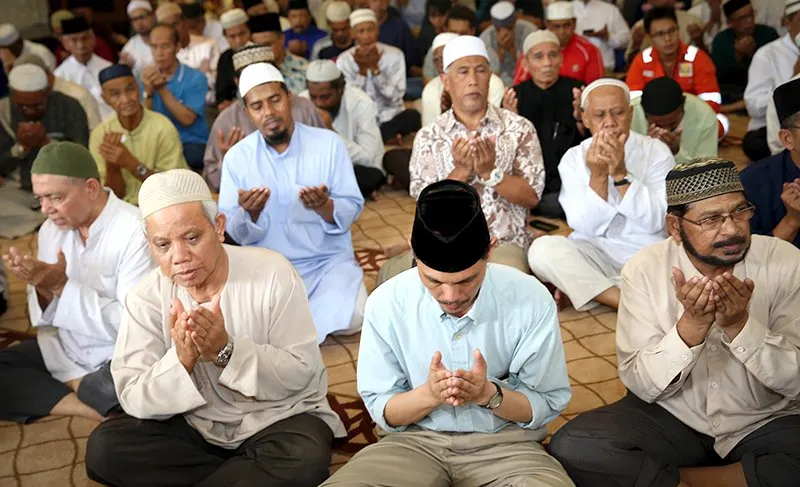 Muslim men praying in mosque